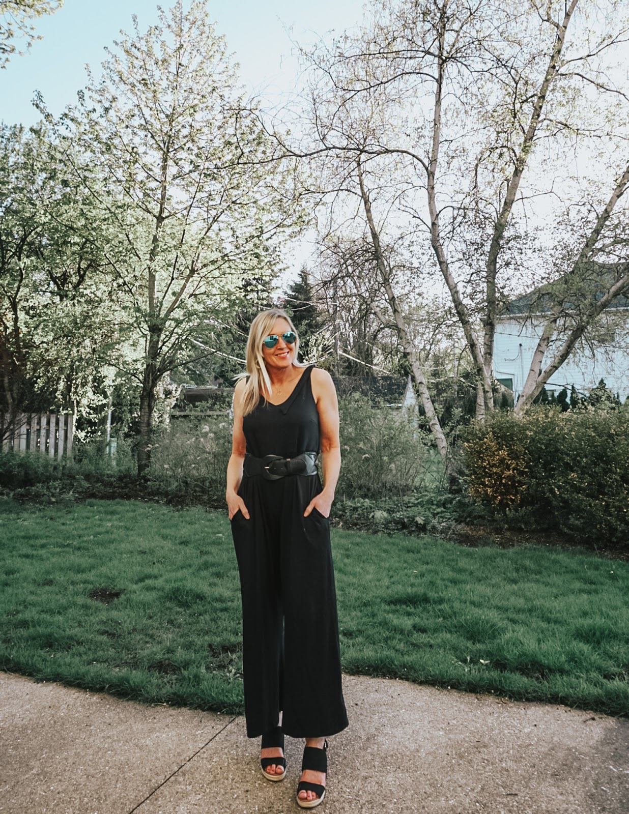 How to Style a Black Jumpsuit Spring Summer Doused in Pink